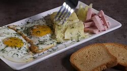 Eating Fried eggs with melted Romanian cheese Stock Footage