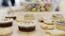 Close up of cookies and cupcake at table Stock Footage