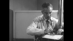 Lab technician uses a Gamma Scintillation Counter on male subject during radiation research News Clip