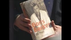 Boris Becker posing for photos with his autobiography News Clip