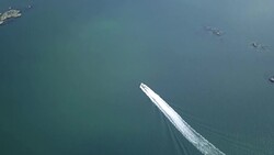 Drone shot of boat going through the Swedish archipelago Stock Footage
