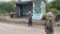 CLEAN : Checking for Russians: Children play on Ukraine's roads News Clip