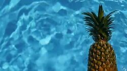 Pineapple Floating In blue Water In Swimming Pool. Healthy Raw Organic Food. Juicy Fruit. Vegetarian, Vegan Nutrition, Vitamins, Diet, summer holidays, vacation concepts. Exotic tropical background Stock Footage