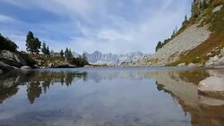 Time lapse of lake Spiegelsee (Mirror Lake) with reflections of the Dachstein mountains. Reiteralm, Schladming-Dachstein, Austria. Stock Footage