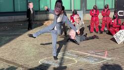 Climate activists stage protest posed as world leaders in Squid Game News Clip