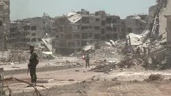 CLEAN : Syrian troops raise flag in Hajar al-Aswad after ousting IS News Clip