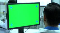 Scientist male talking about working in modern laboratory or medical center. Background monitor green screen. Concept of science, testing development and lab industry. Stock Footage