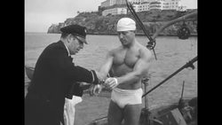 At age 40 fitness guru Jack LaLanne swims from Alcatraz to Fisherman's Wharf while wearing handcuffs News Clip
