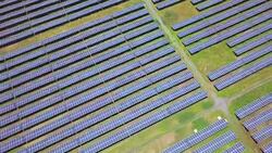 Solar Cell Aerial view flying over large solar farm clean renewable energy Stock Footage