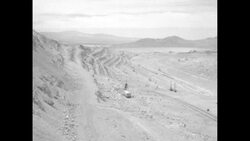 Heavy equipment, mine, and an explosion at the Chuquicamata, Chile Copper Mine News Clip