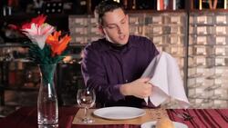 How to Do the Coin through a Napkin Trick Instructional Video