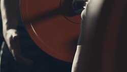 Male athlete taking bar and lifting weight during training with support Stock Footage