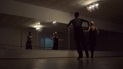 Man and a woman are dancing in the studio Stock Footage