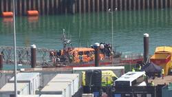 RNLI lifeboat transports around 50 suspected migrants into Dover News Clip
