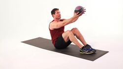 How to Do One-Arm Alternating Sit-Ups with a Medicine Ball Instructional Video