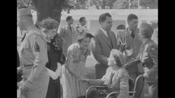 Pres. Dwight Eisenhower and First Lady Mamie host a garden party for disabled veterans at the White House in Washington, DC News Clip