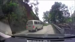 Huge landslide narrowly misses vehicle on road News Clip