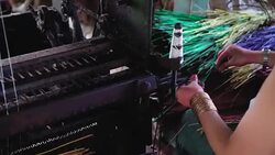 4k footage scene of Vietnamese craftswoman using Mat weaving machine the traditional vietnam mats in the old traditional village at Dinh Yen, Dong Thap, Vietnam, Tradition and manufacture concept Stock Footage