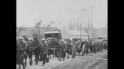 In France during World War I, British soldiers marching and French soldiers guarding German POWS as they march along News Clip