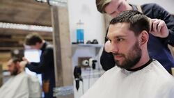 man and stylist doing haircut at barber shop Stock Footage