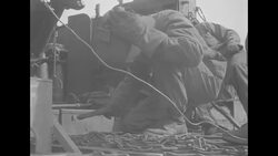 During Korean War, UN soldiers maintaining mobile artillery piece somewhere in South Korea News Clip