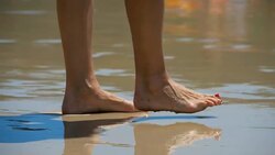 Barefoot beach walking Stock Footage