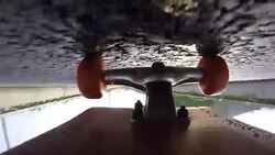 Under skateboard upside down POV - A person skating on a highway road Stock Footage