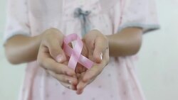 Girl with a pink ribbon. Cancer awareness concept. Stock Footage