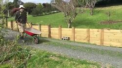 Adult Senior Man Pushing an Empty Wheel Barrel Stock Footage