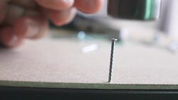 Close up,Hand using hammer to stuck nail in to the wood Stock Footage
