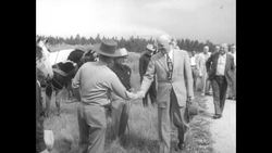 President Dwight D. Eisenhower arrives at Colorado ranch for vacation and shows young boy how to fly cast News Clip