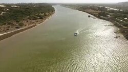 AERIAL boat on estuary/ Port Elizabeth/ South Africa Stock Footage