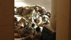 National Guard troops resting inside the US Capitol building News Clip