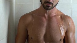 Handsome athletic man taking shower, relaxing at home after stressful day Stock Footage