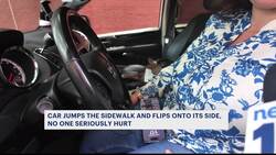 Car jumps sidewalk, overturns in Mott Haven crash News Clip