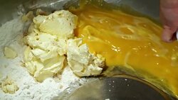 Pouring Egg Mixture into Flour and Butter Stock Footage