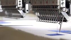 Automatic modern sewing machine embroider a pattern,Industrial embroidery equipment. Textile Manufacturers.Industrial textile factory,Textile Factory. Textile Industry. Stock Footage