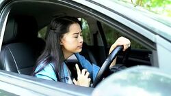 Breakdown of the car on the road. The girl is waiting for the tow truck. The girl is upset by the car breakdown. Stock Footage