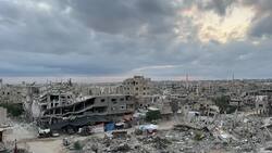Sun rises over wreckage of bombed buildings in Khan Younis, Gaza News Clip