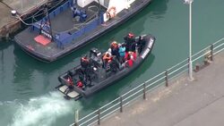 Aerial views of Border Force raft bringing migrants ashore News Clip