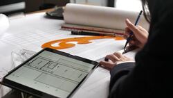 Businesswoman Hand drawing work on blueprint Stock Footage