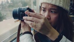 Asian tourist woman taking pictures of view with her camera Stock Footage