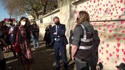 UK: Bereaved families paint mural of almost 150,000 red hearts to represent Covid-19 victims News Clip
