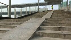 Young woman runner sportswoman running down descent city stairs jogging and running in urban training workout Stock Footage
