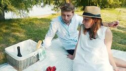 Young couple on picnic in park. Stock Footage