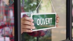 SLOW-MO: Young man opening a French shop Stock Footage