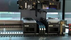 Automated pipetting robot dispensing liquid into trays News Clip