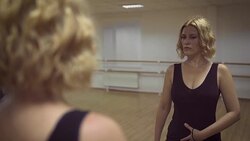 Beautiful girl in front of a mirror in a dance studio Stock Footage