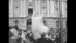 After their wedding ceremony in Toulouse, tightrope walkers Roger Decugis and Berthy Omankowski receive priest's benediction on tightrope News Clip