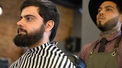 Male barber is preparing customer for shave Stock Footage